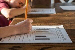 student writing a psychometric assessment